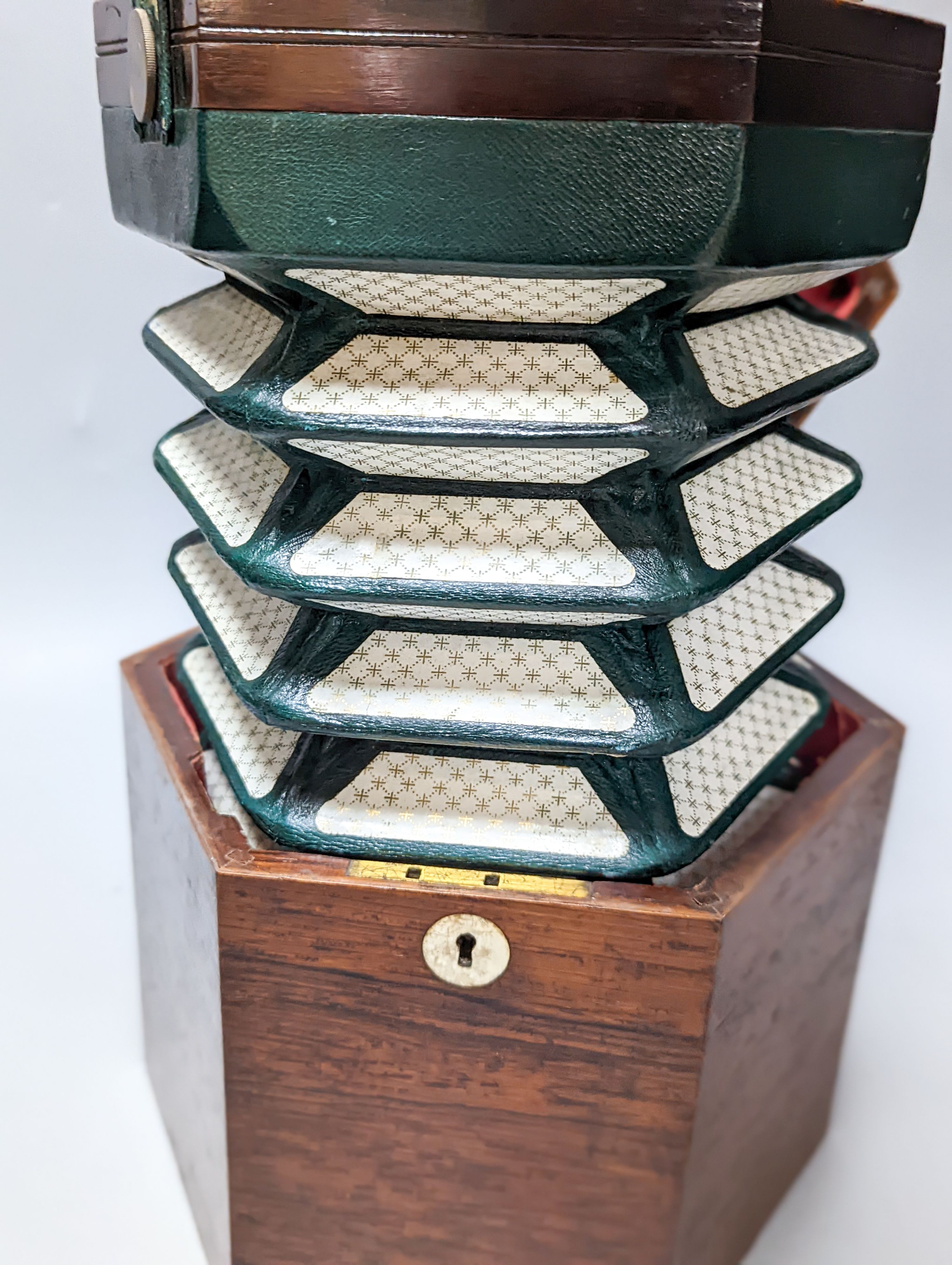 A 19th century rosewood 48 button cased concertina, by Butler, Haymarket, London, rosewood box, damage